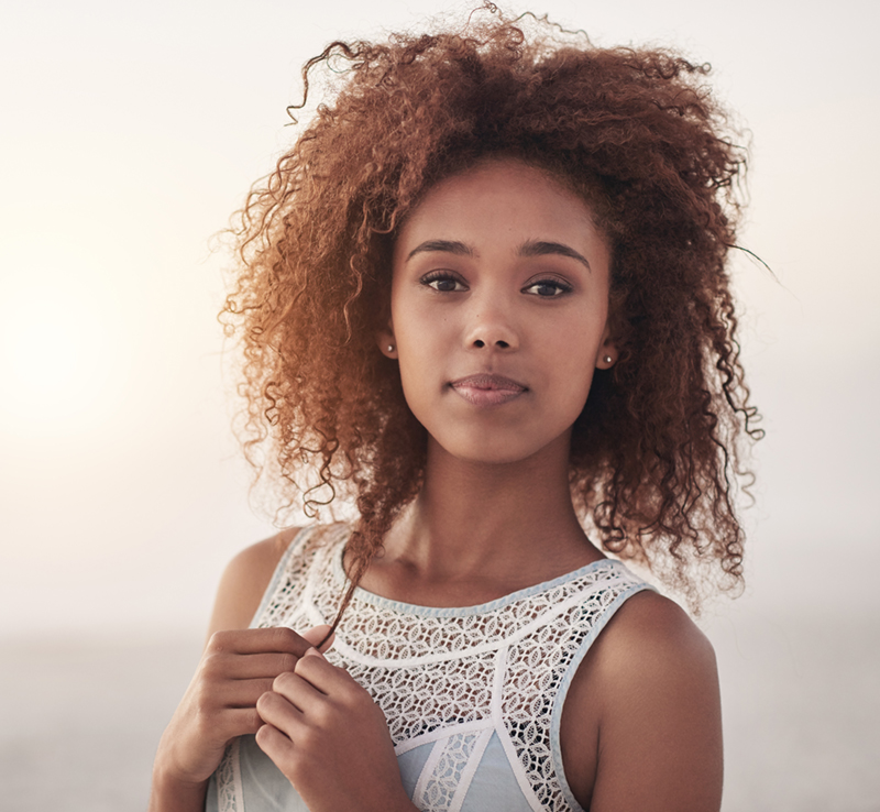 woman looking at the camera with a serious look on her face